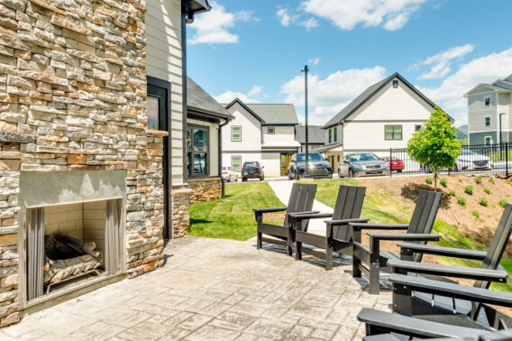 Outdoor lounge featuring a fire pit